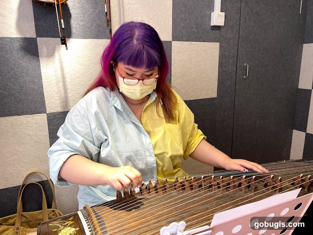 Woman playing a Guzheng