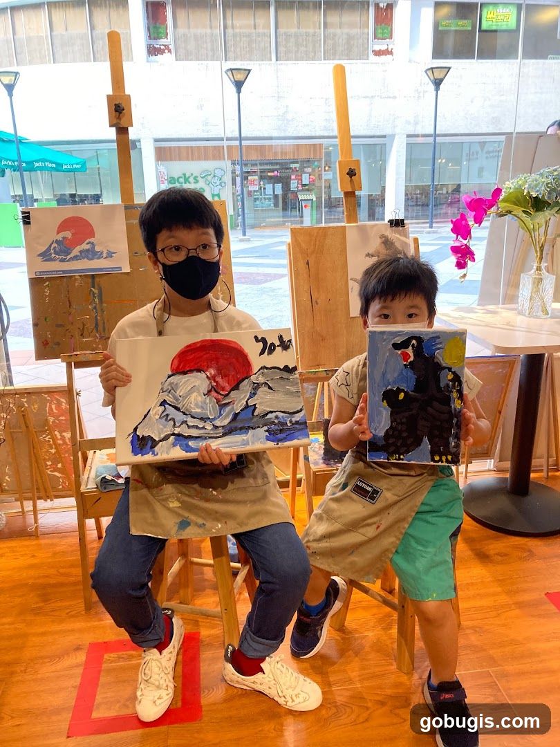 Children Showing Paintings