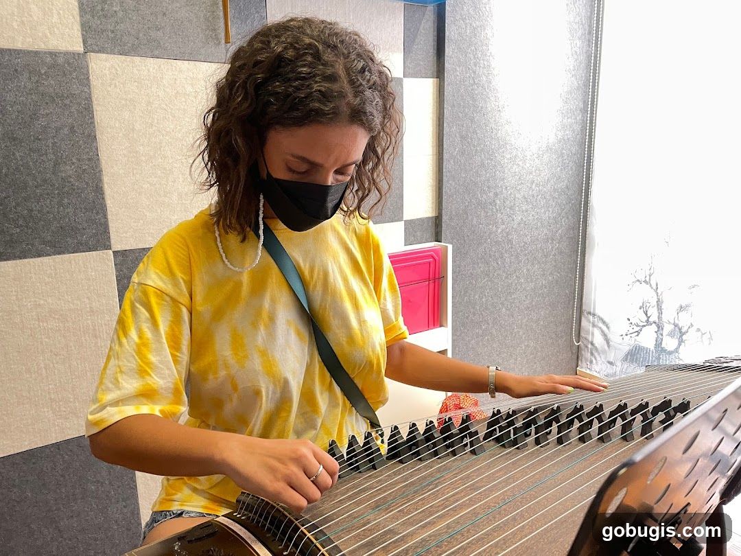 Woman playing a zither