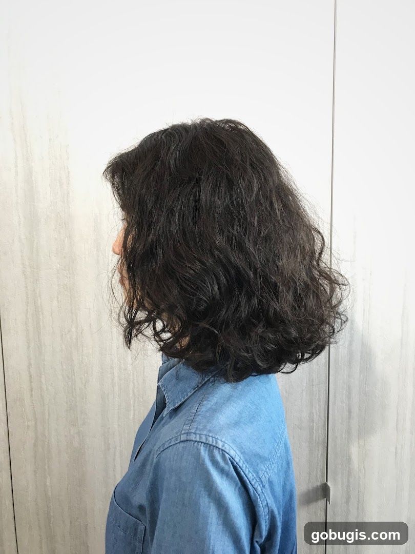 Woman with dark curly hair