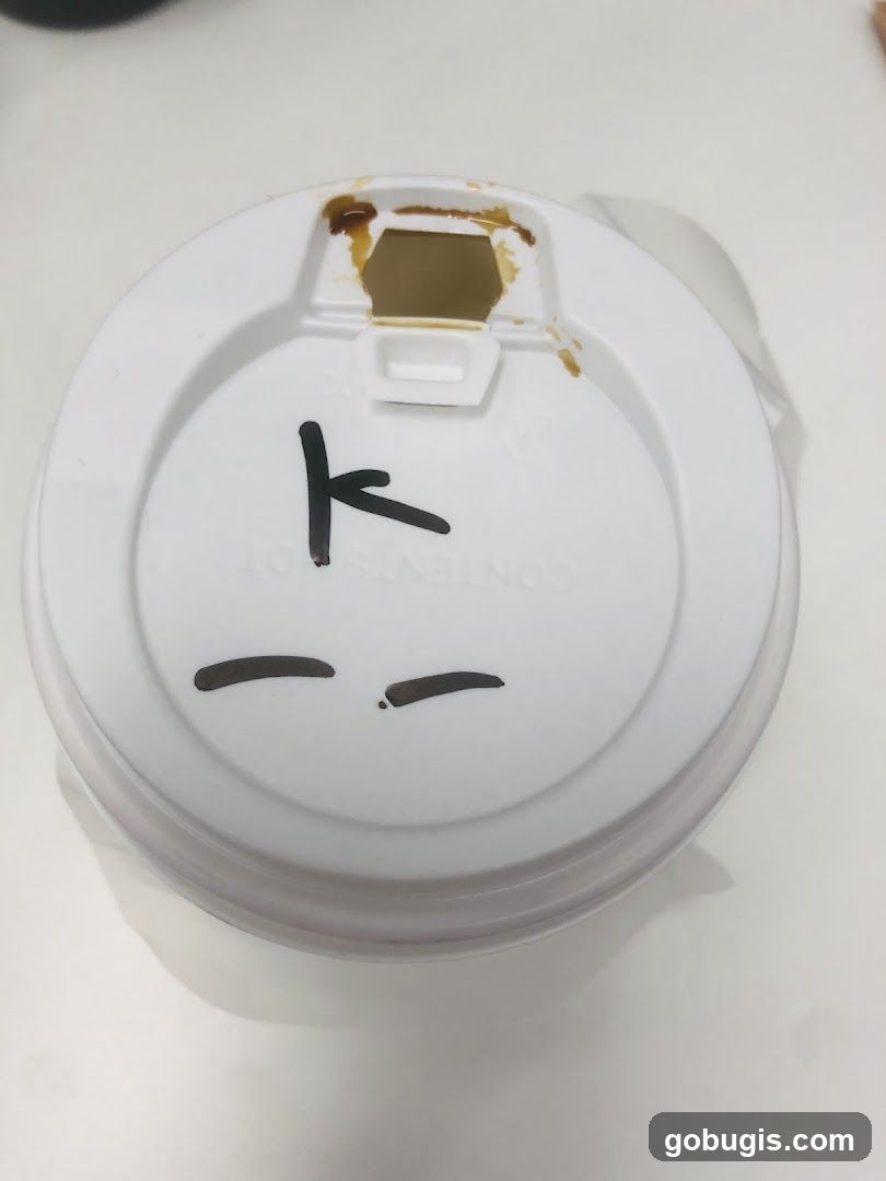 Coffee cup lid with markings