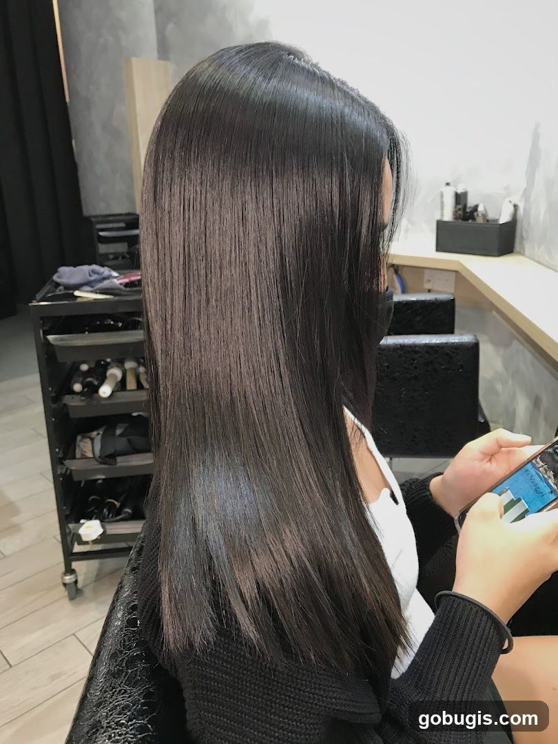 Woman with long, dark, straight hair