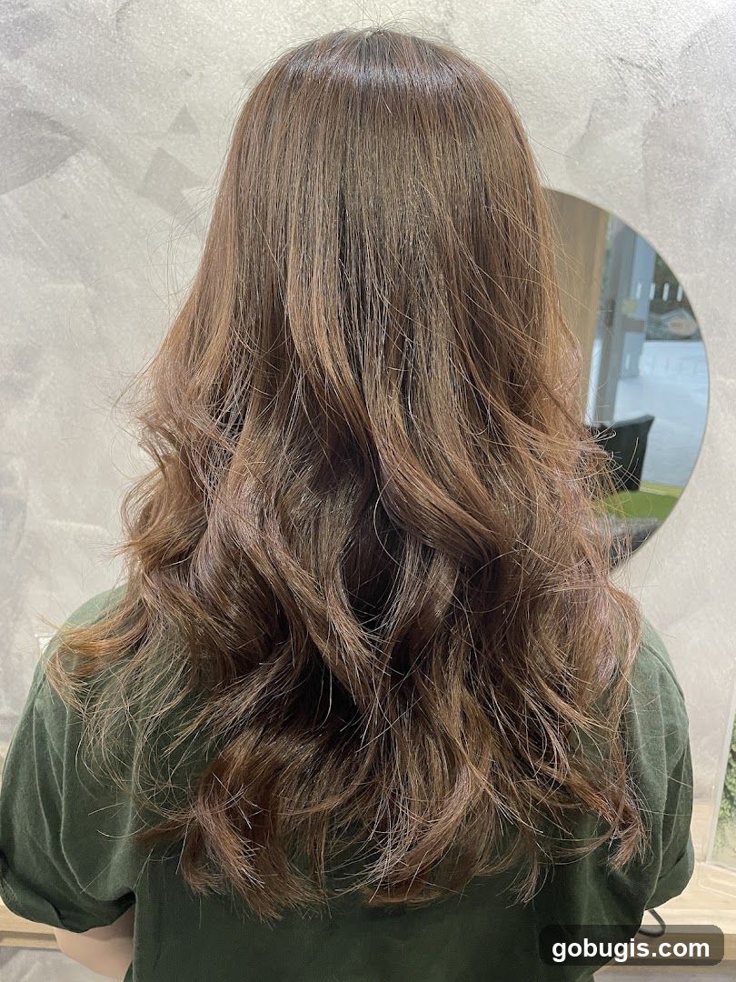 Woman with long, wavy brown hair