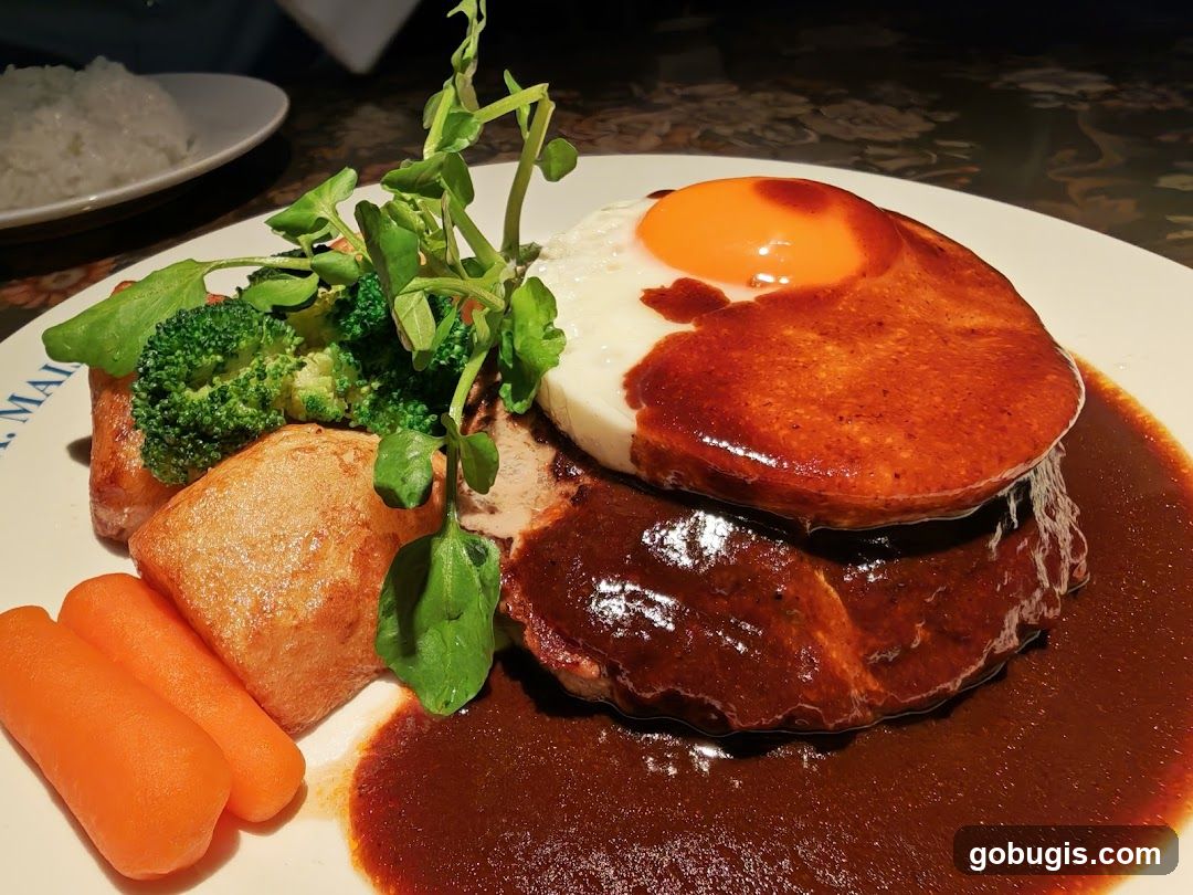 Hamburger steak with fried egg and vegetables