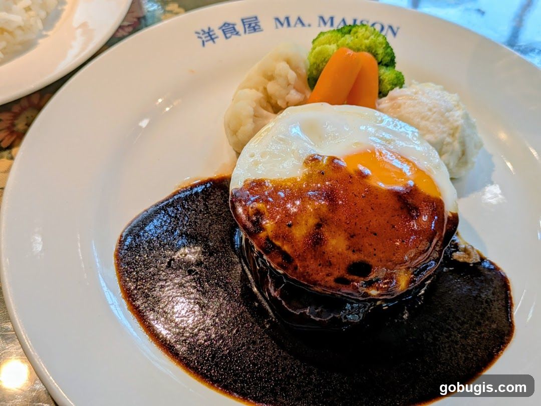 Hamburger steak with fried egg and vegetables