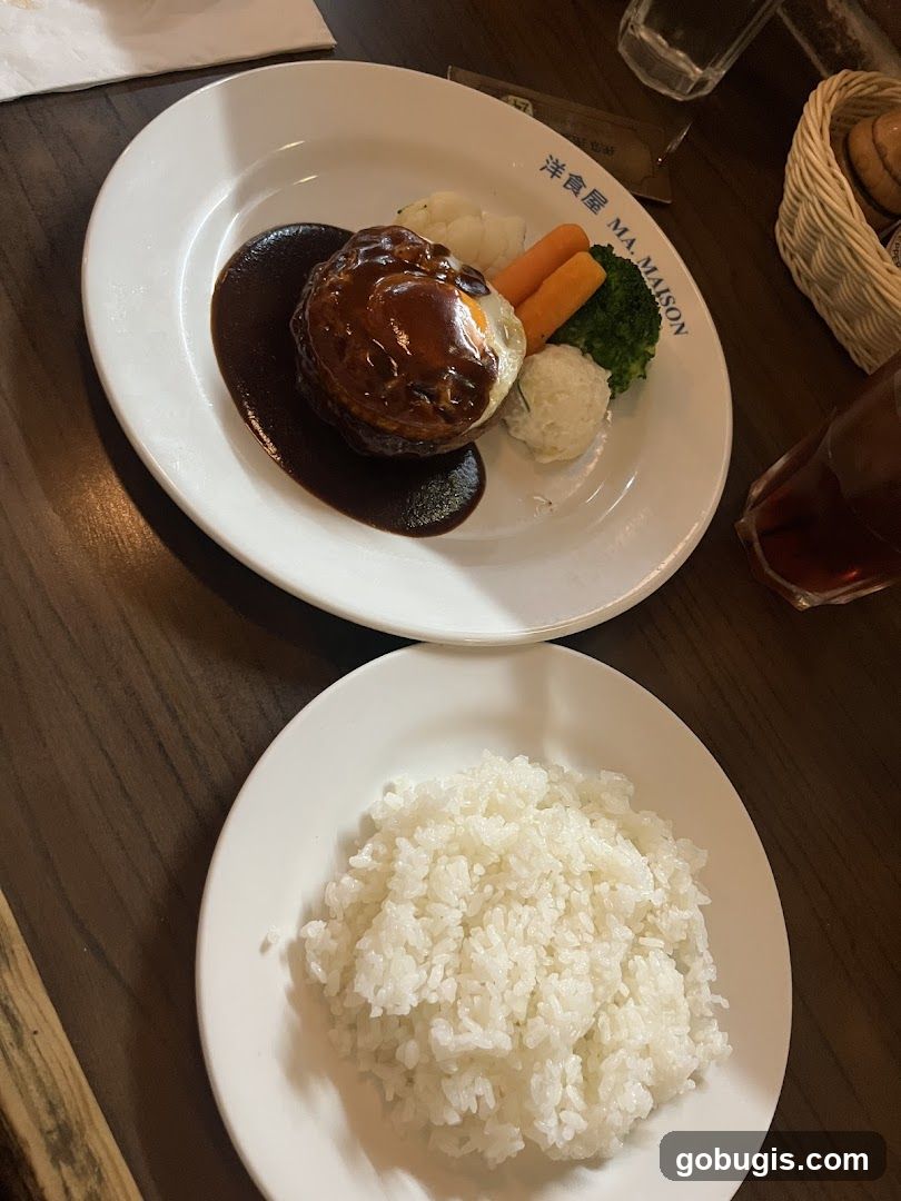 Hamburger steak with fried egg and vegetables