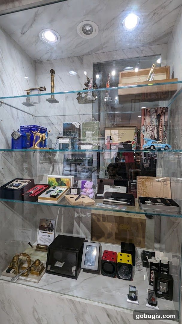Display Case with Writing Instruments and Collectibles