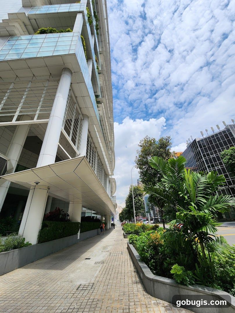 Modern Building Facade with Lush Greenery