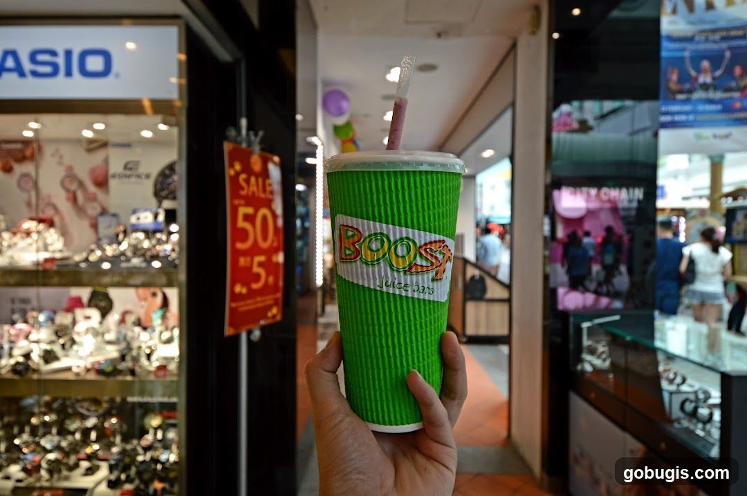 Hand holding a Boost Juice cup