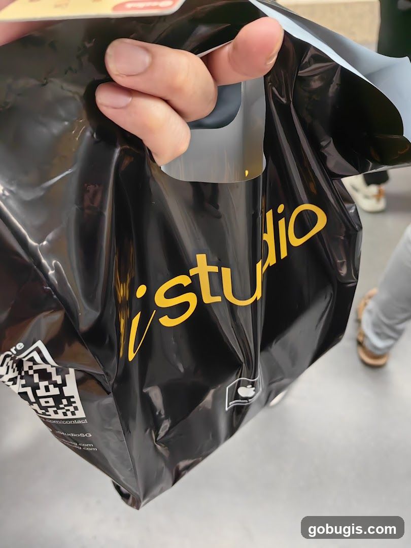Black shopping bag with yellow logo