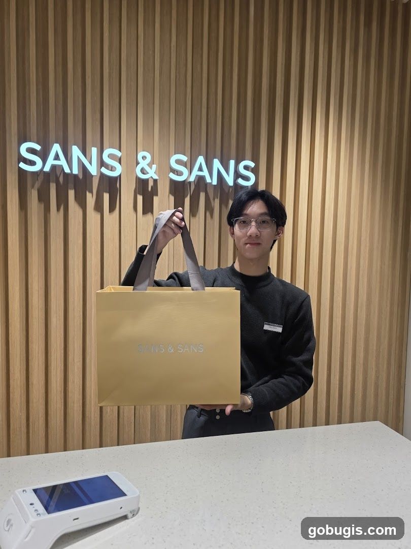 Employee holding shopping bag