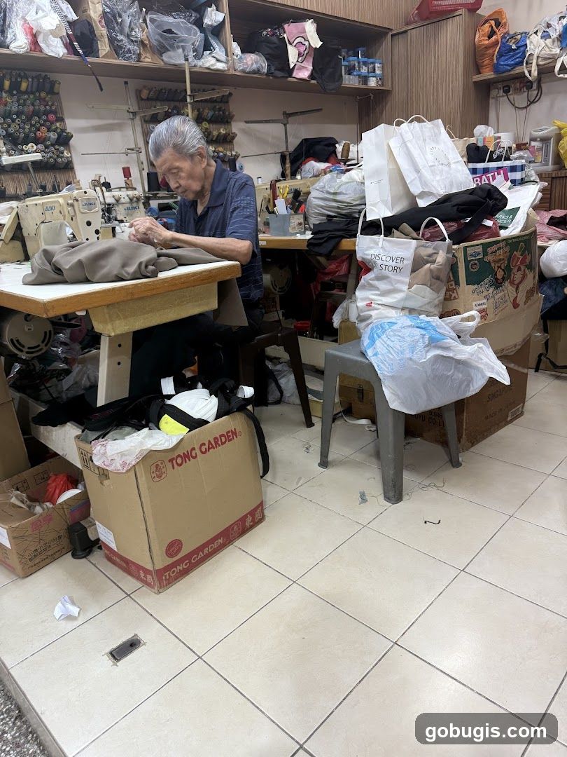 Tailor working at sewing machine