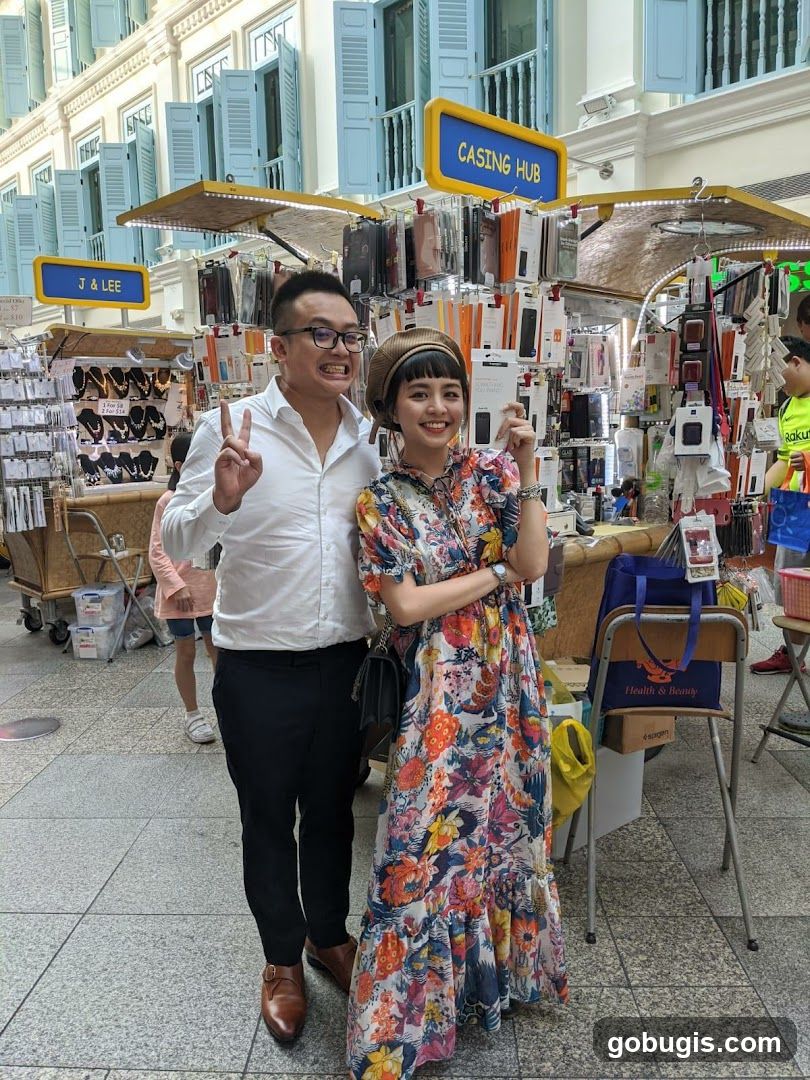 Couple Posing in Front of Stalls