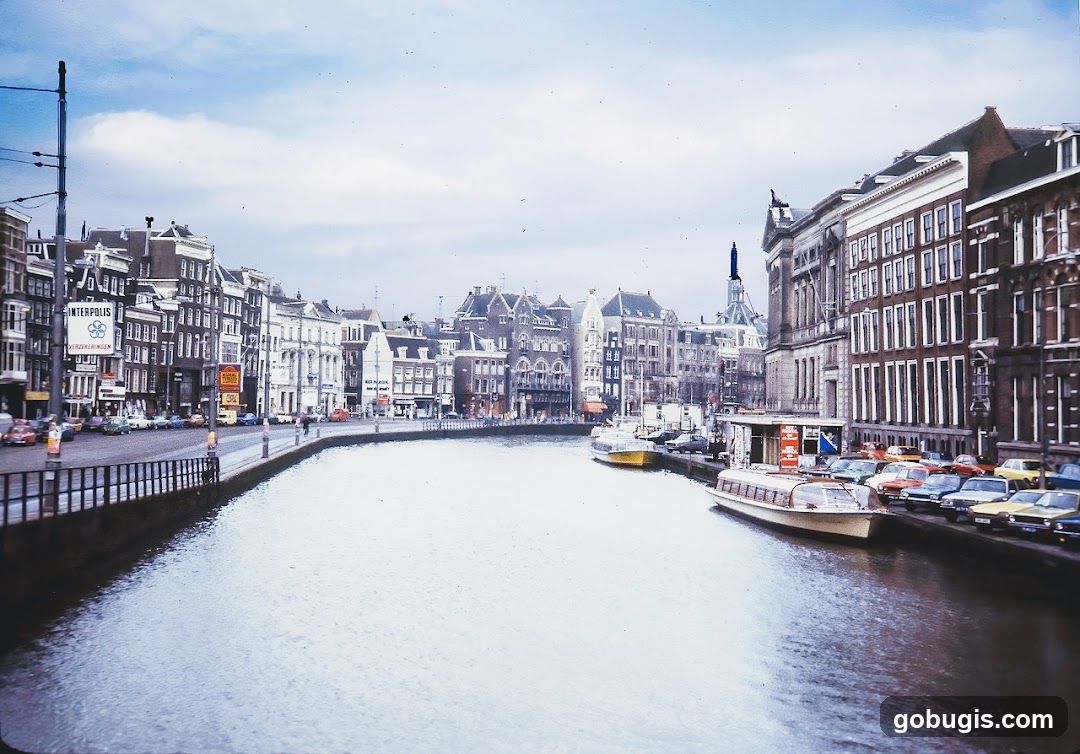 Canal in Amsterdam with Boats and Buildings