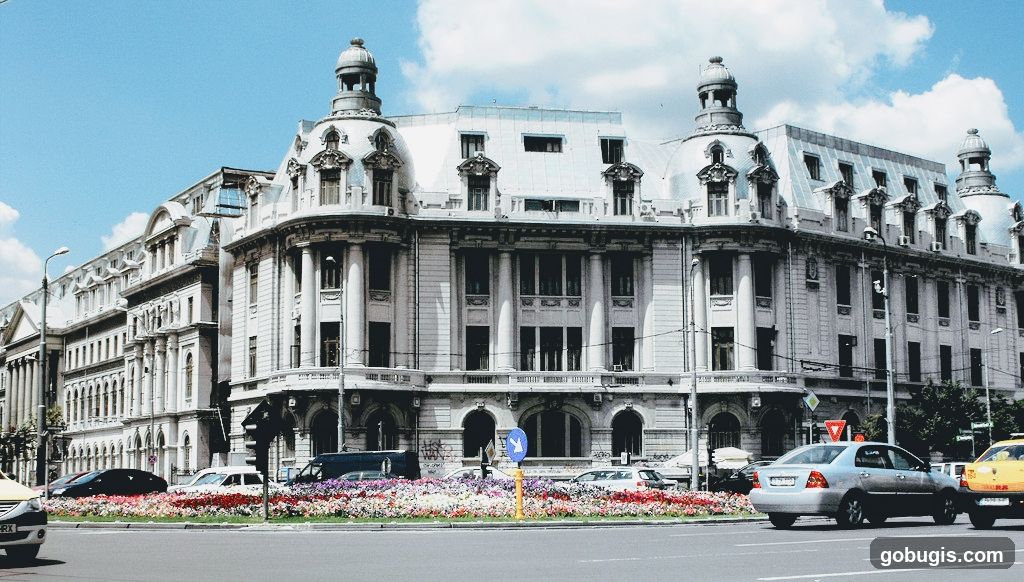 Ornate Building Facade with Flowerbeds