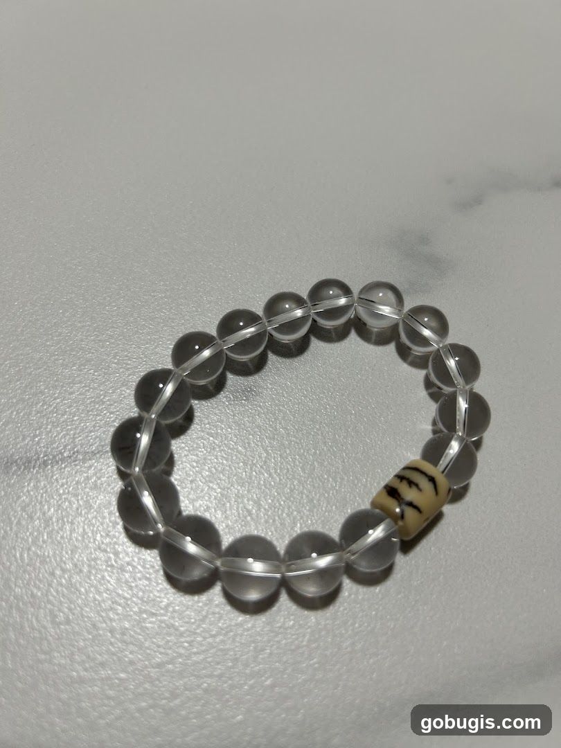 Beaded bracelet with tiger stripe charm