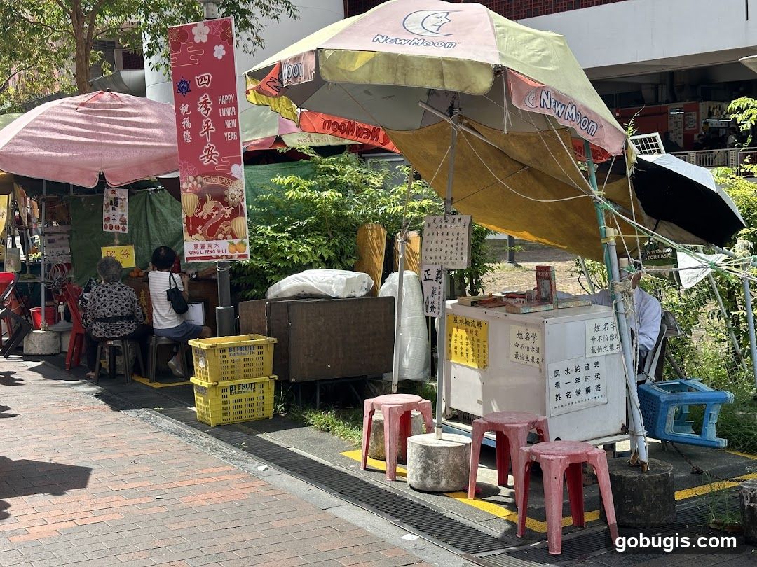 Street stall with Lunar New Year decorations and fortune telling services