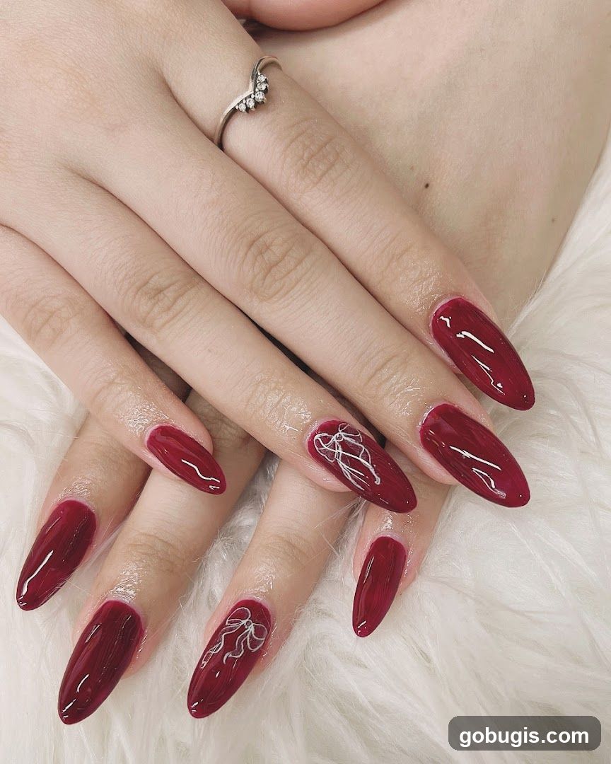 Red Almond Nails with Bow Design