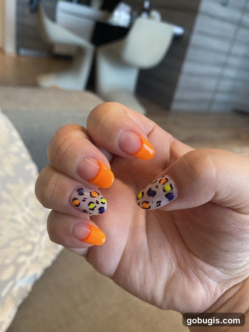 Leopard Print and Orange French Tip Nails