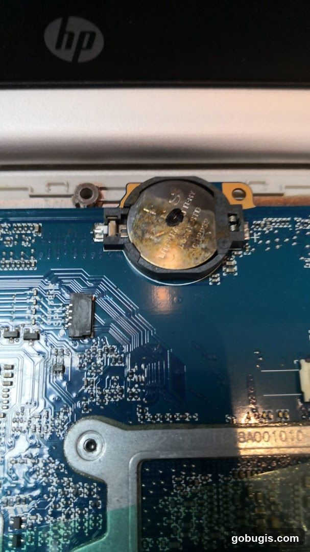 Corroded CMOS Battery on Motherboard
