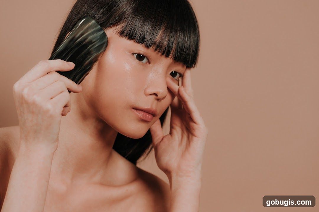 Woman using a Gua Sha tool