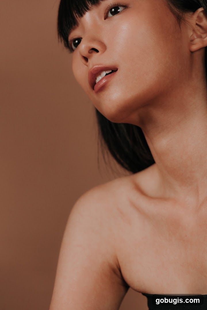 Close-up of a woman's face and shoulder