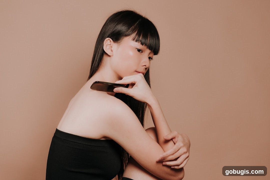 Woman with Gua Sha Tool