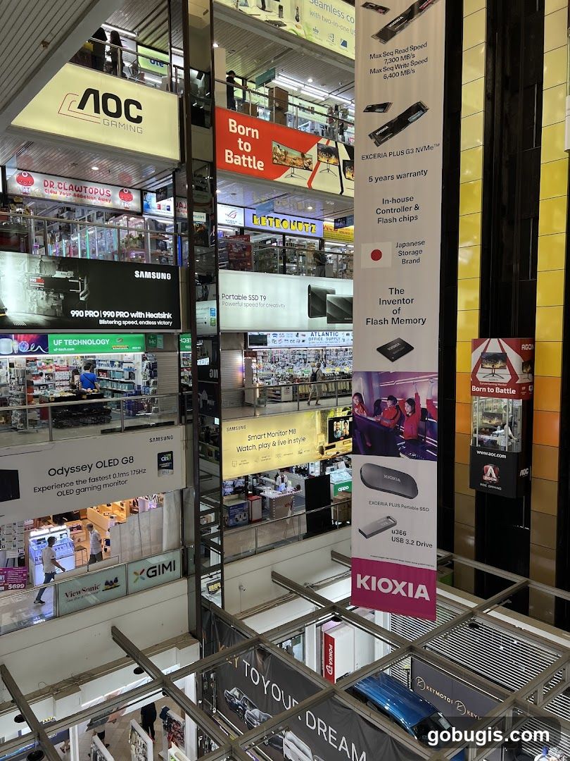 Electronics store interior with multiple advertisements
