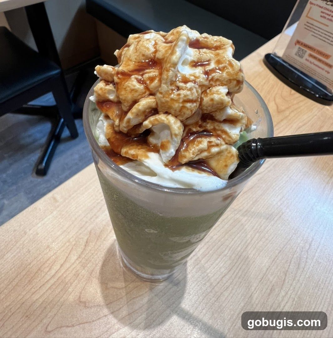 Green Tea Frappe with Whipped Cream and Caramel Drizzle