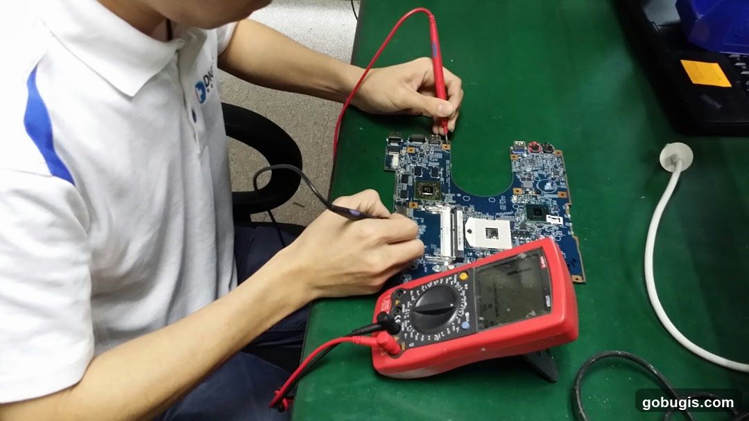 Technician testing a motherboard