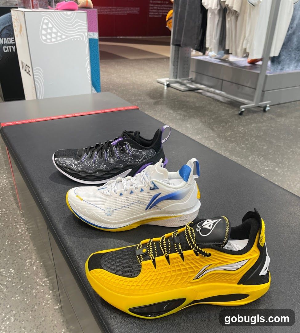 Three pairs of athletic shoes on display