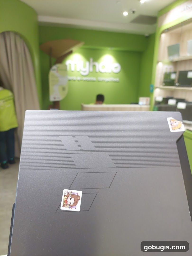 Laptop with Stickers in Store