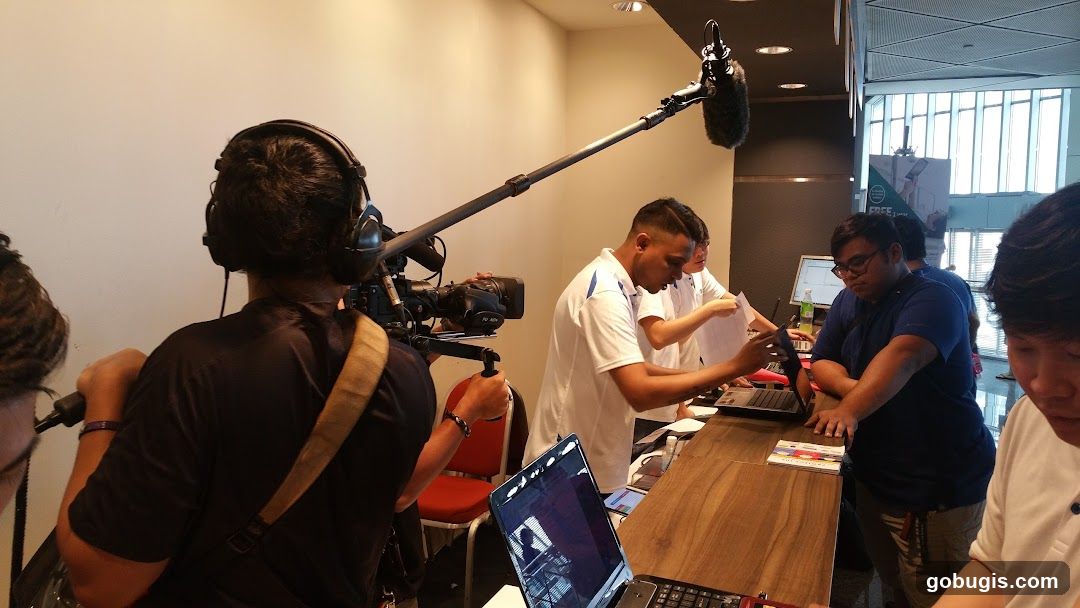 Filming a group of people at a counter