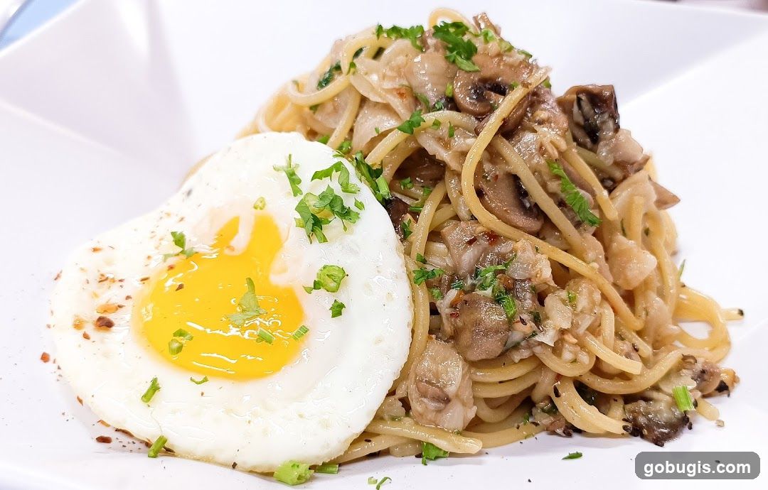 Spaghetti with Fried Egg and Mushrooms