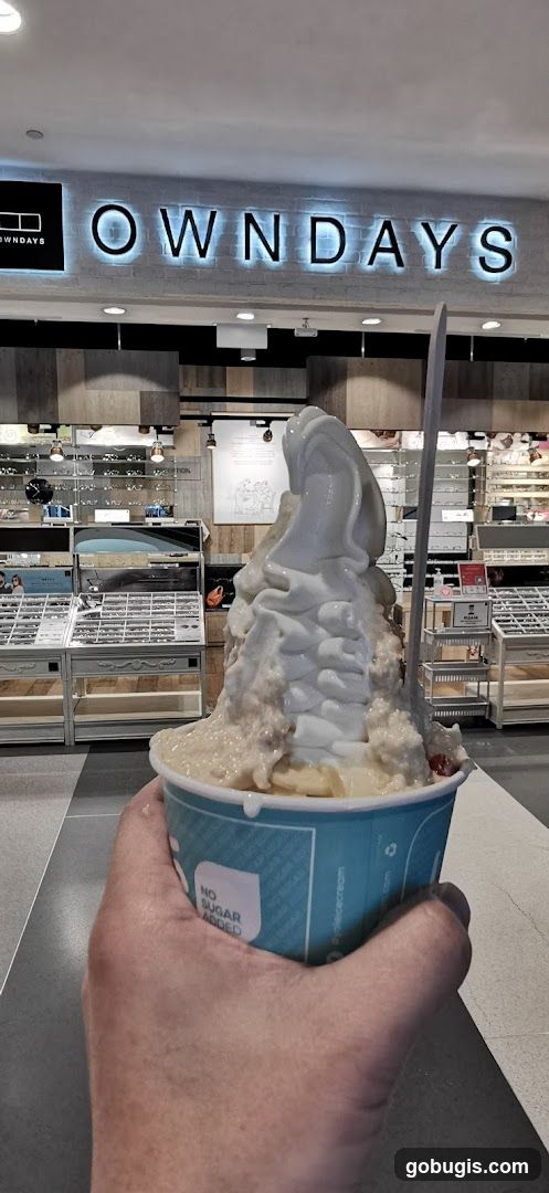 Ice Cream Cup in Front of Eyewear Store