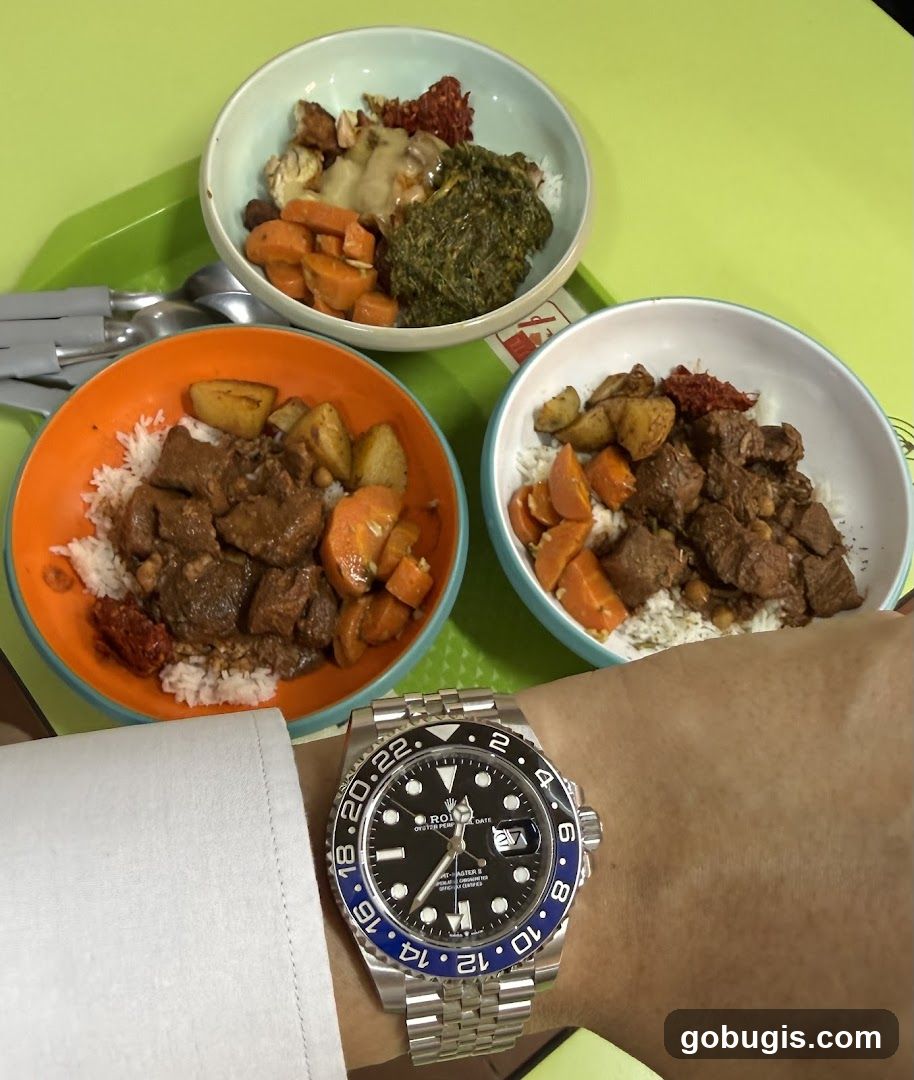 Three bowls of food and a watch