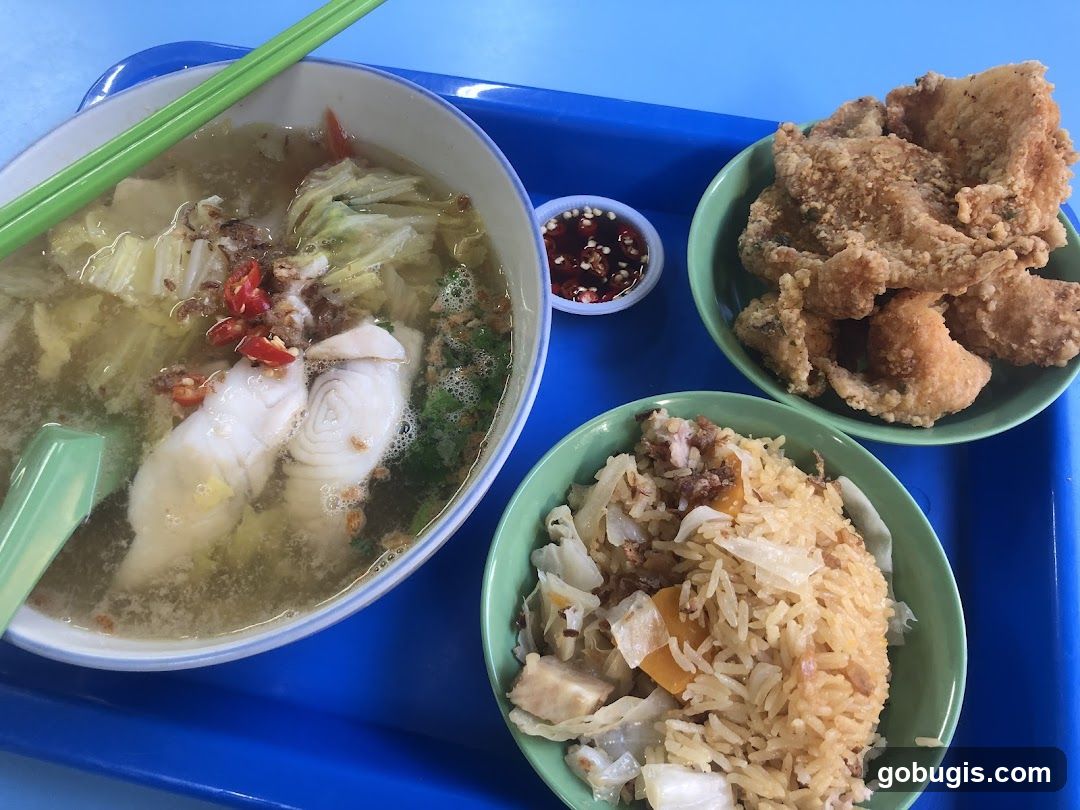 Fish soup with rice and fried fish