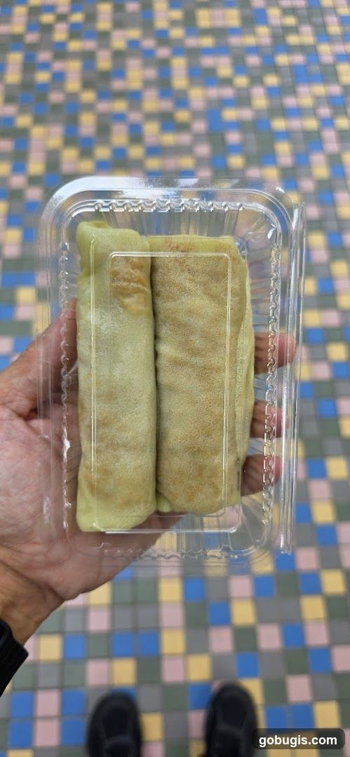 Two Rolled Crepes in a Plastic Container