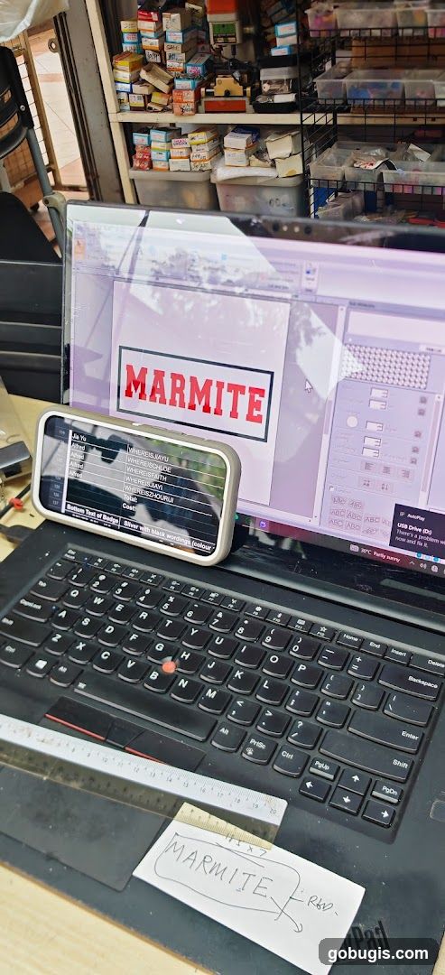 Computer screen displaying Marmite logo