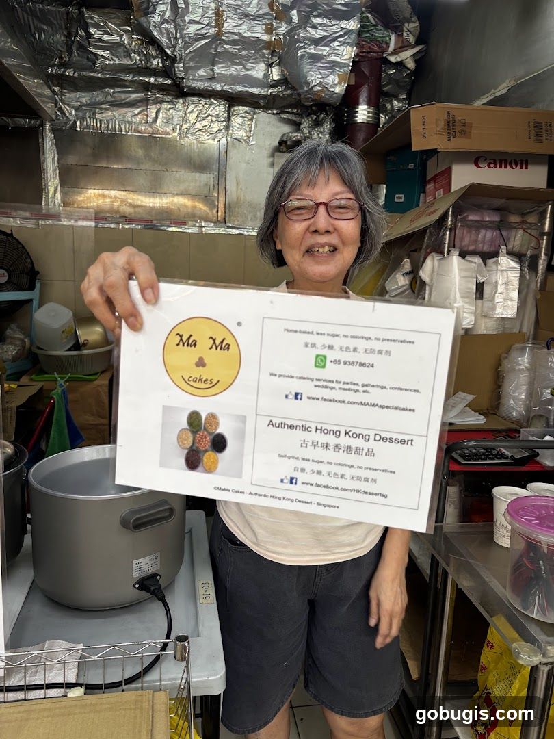 Woman holding a flyer for Ma Ma Cakes