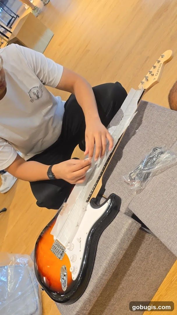 Unpacking a Sunburst Electric Guitar