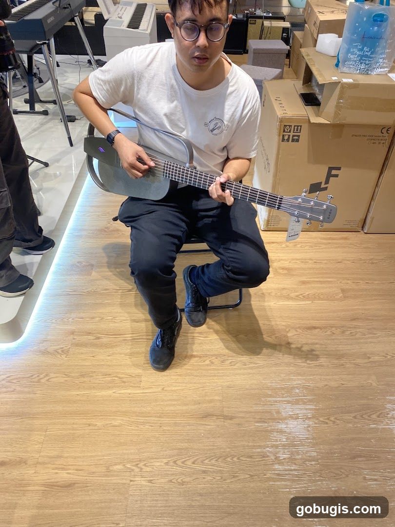 Man playing a guitar in a store