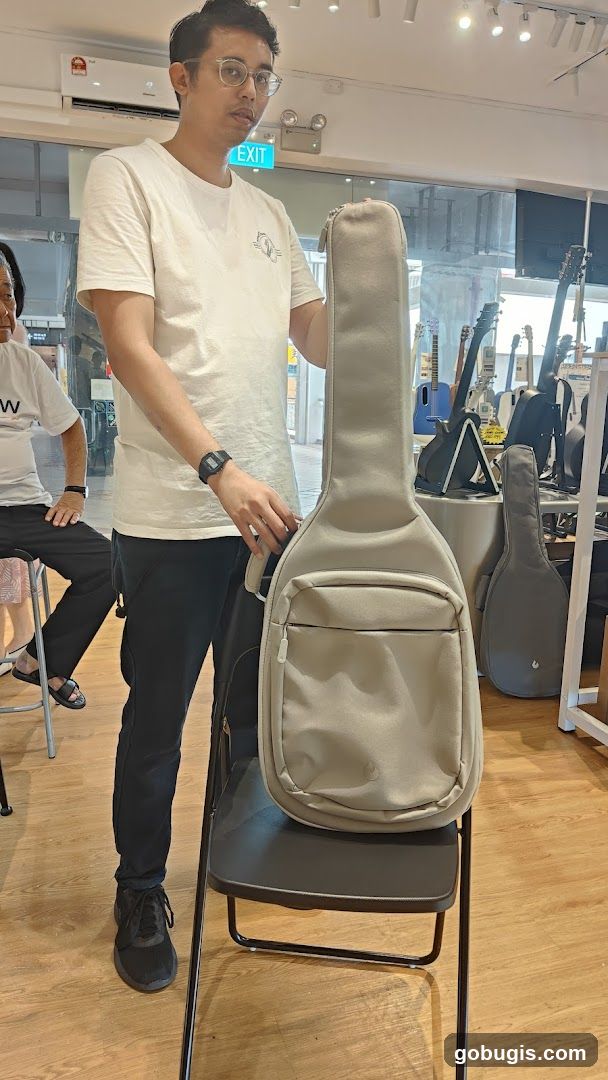 Man Holding Guitar Case
