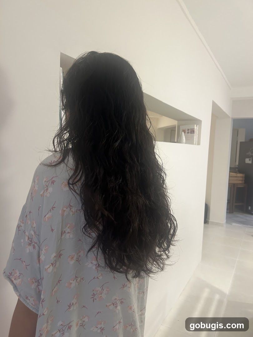 Woman with long dark wavy hair