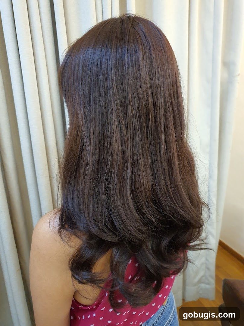 Woman with long, dark, wavy hair