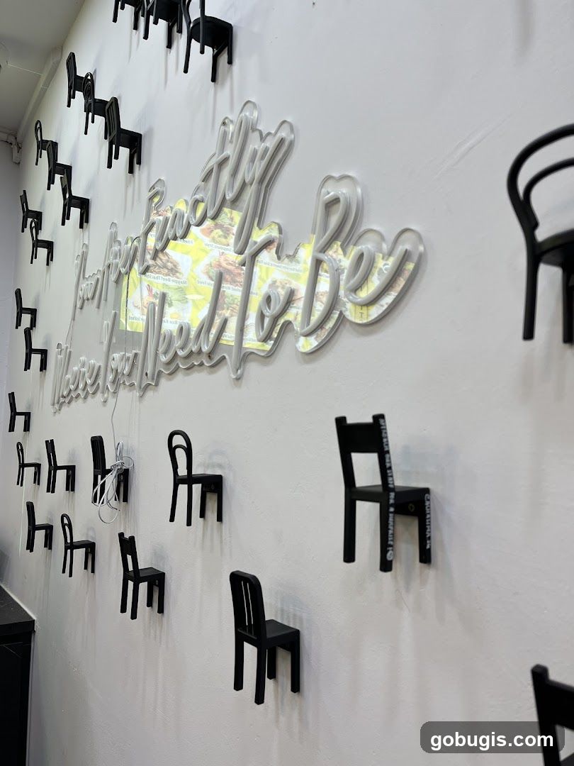 Wall Decor with Neon Signage and Miniature Chairs