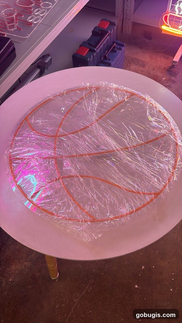 Basketball hoop frame wrapped in plastic
