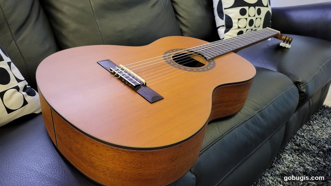 Acoustic Guitar on a Couch
