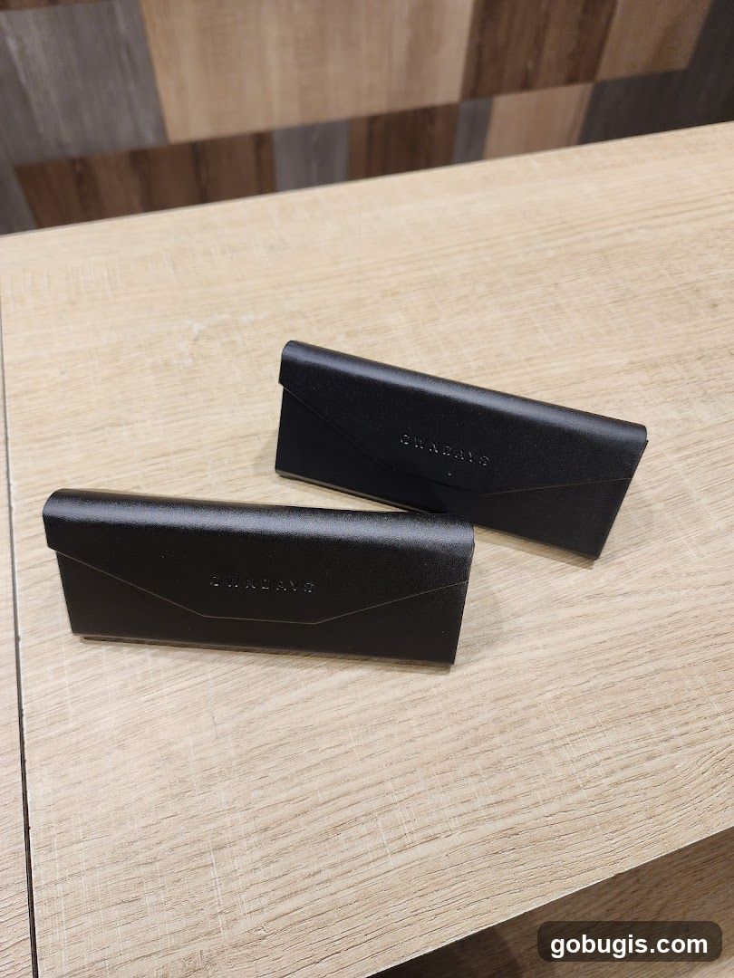 Two black eyeglass cases