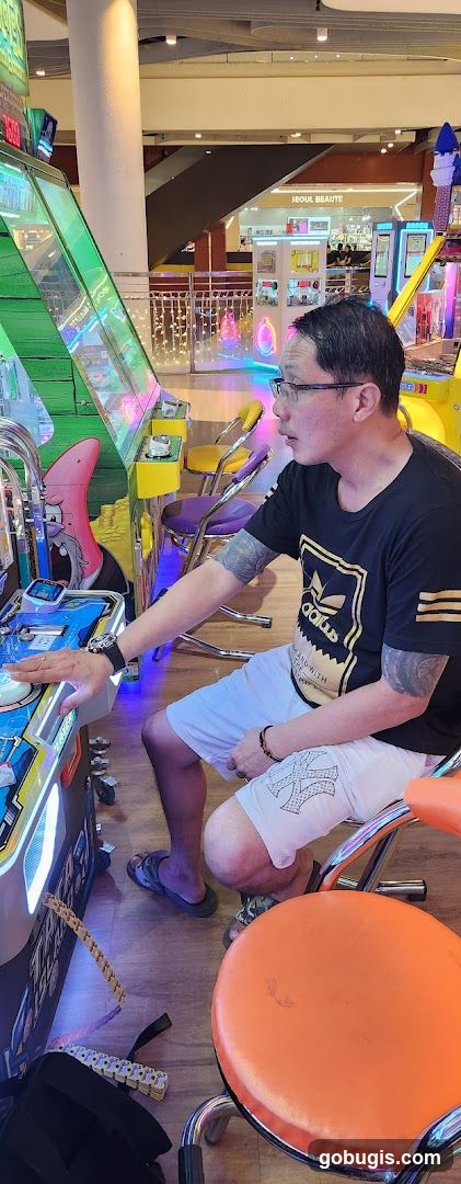 Man Playing Arcade Game